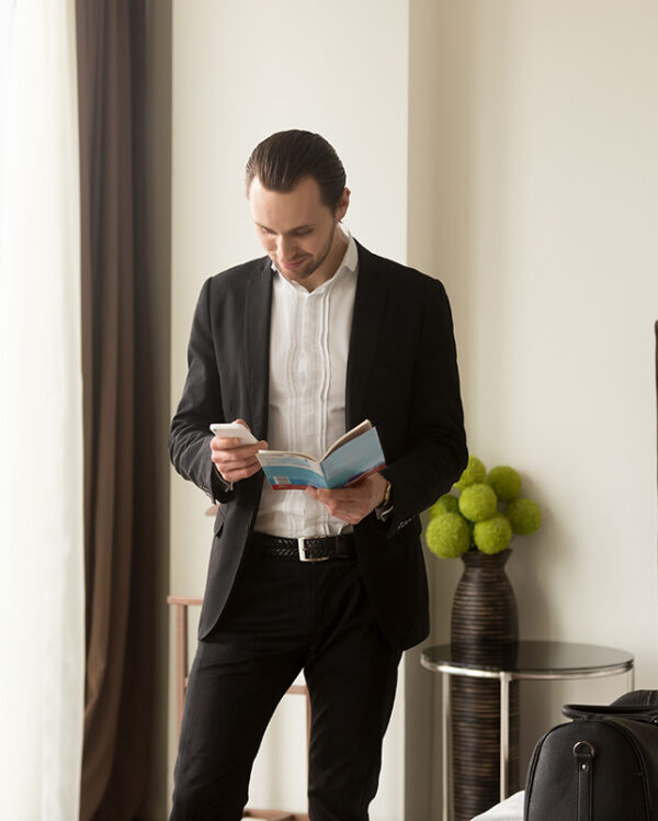 businessman-holds-guide-brochure